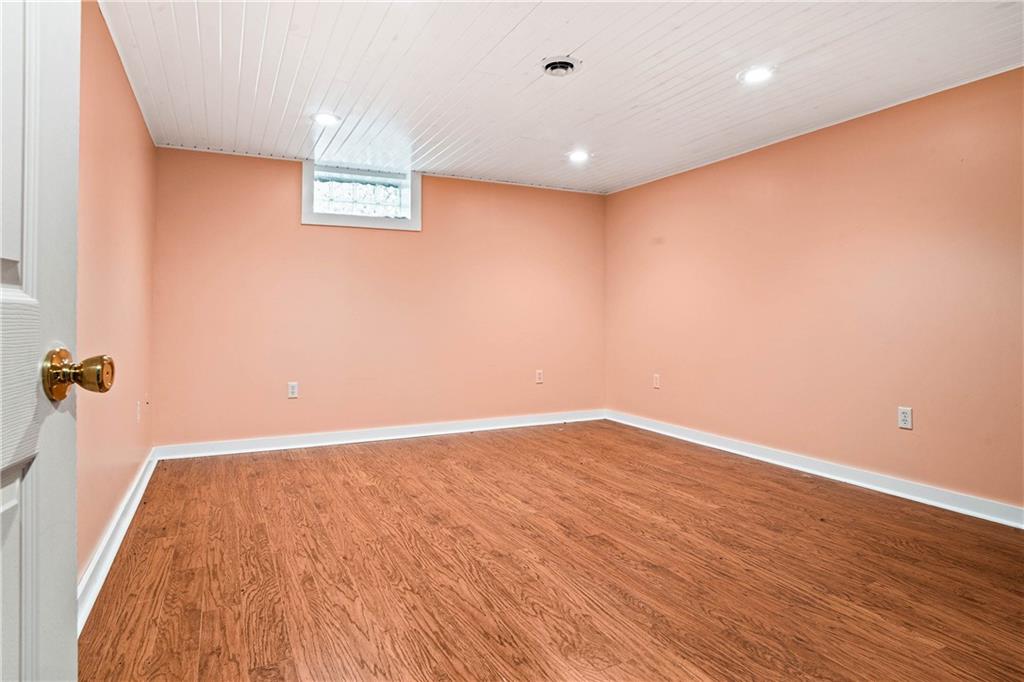 79 Willadell Road Transfer, PA 16154 - Photo 24 of 25 an empty room with wooden floor and windows