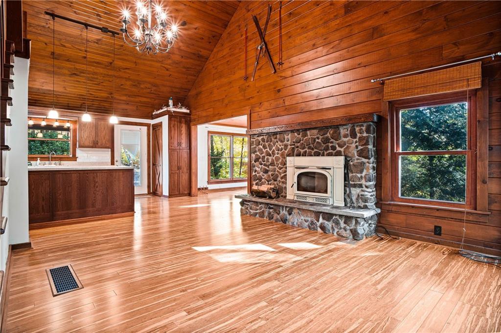 79 Willadell Road Transfer, PA 16154 - Photo 9 of 25 a view of a livingroom with wooden floor and a fireplace