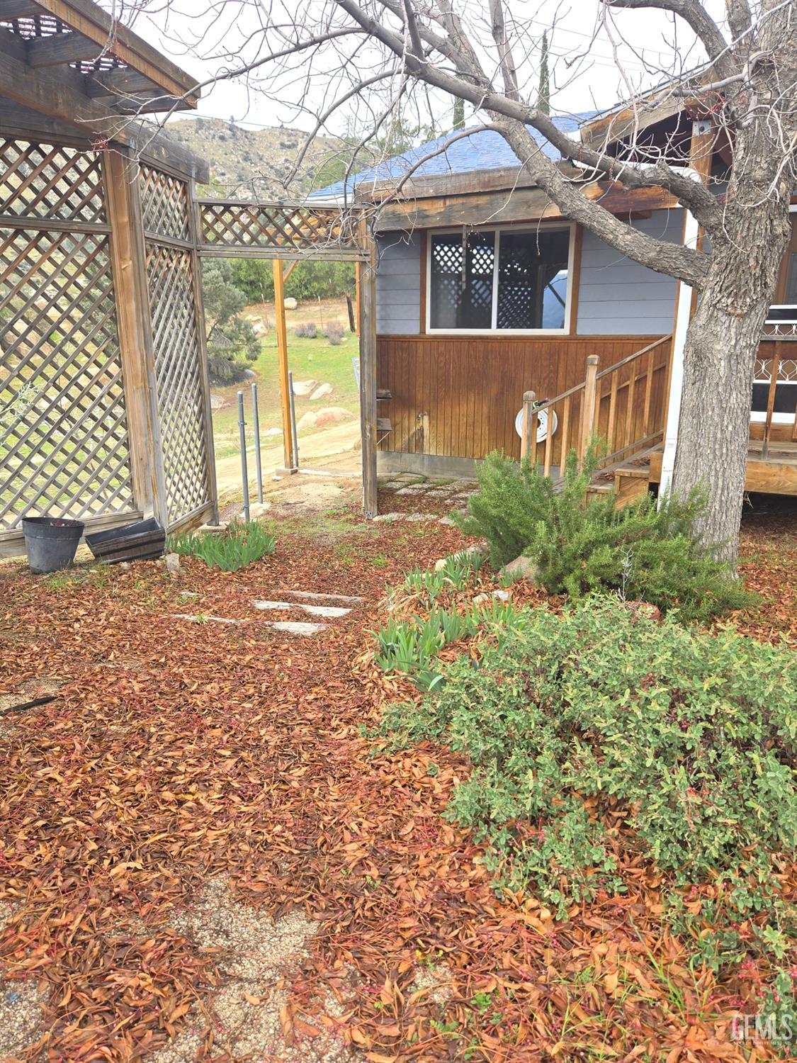 Undisclosed Address Weldon, CA 93283 - Photo 39 of 43 a front view of a house with garden