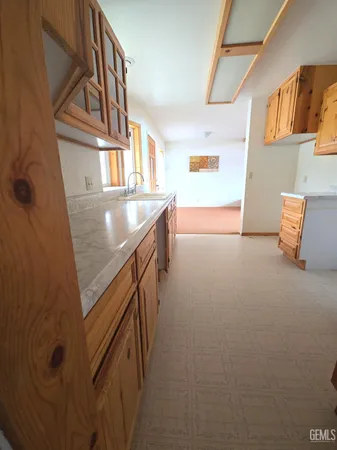 a view of a room with wooden floor and windows