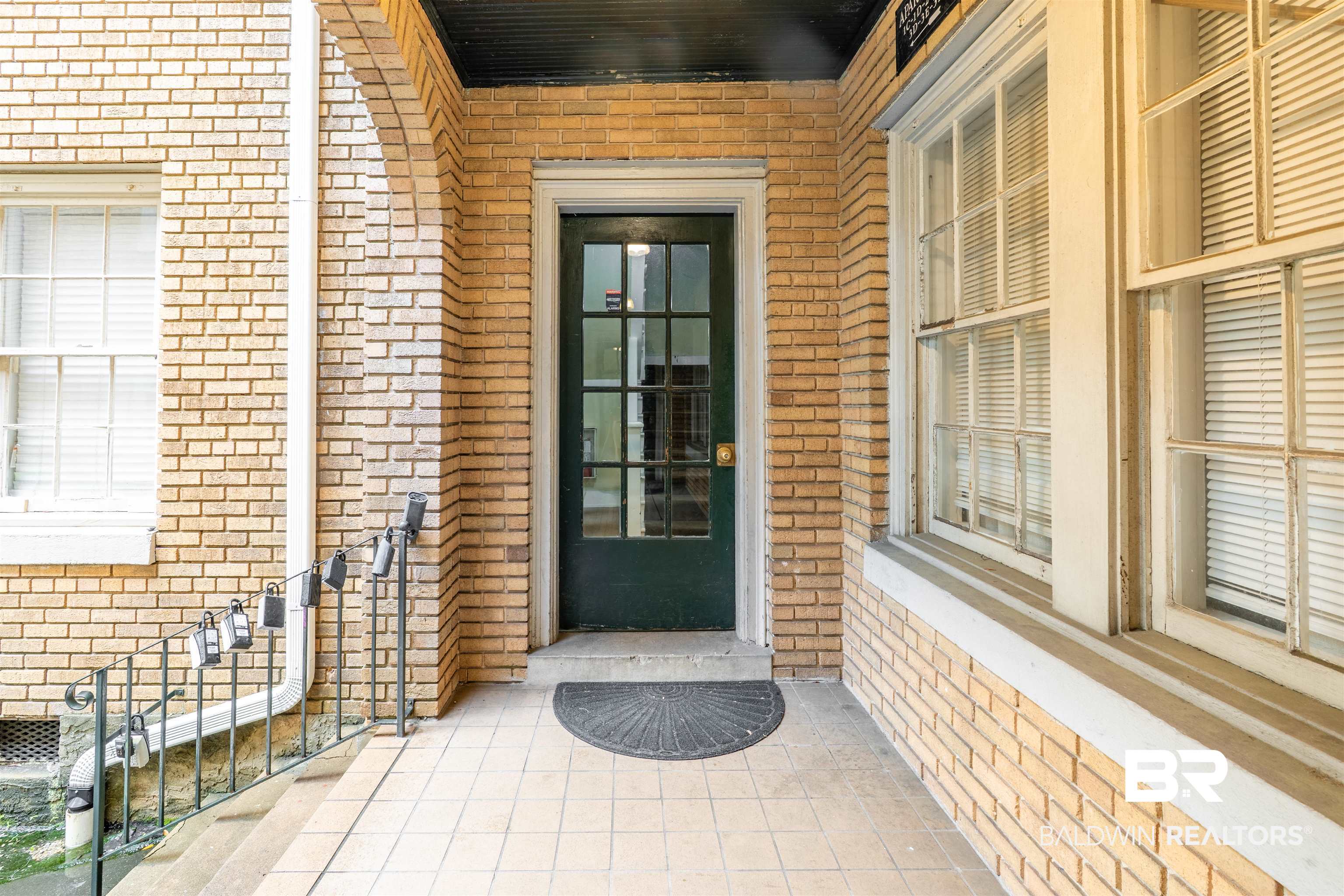 1600 Government Street, Unit 3F Mobile, AL 36604 - Photo 3 of 18 Property entrance with brick siding and a porch