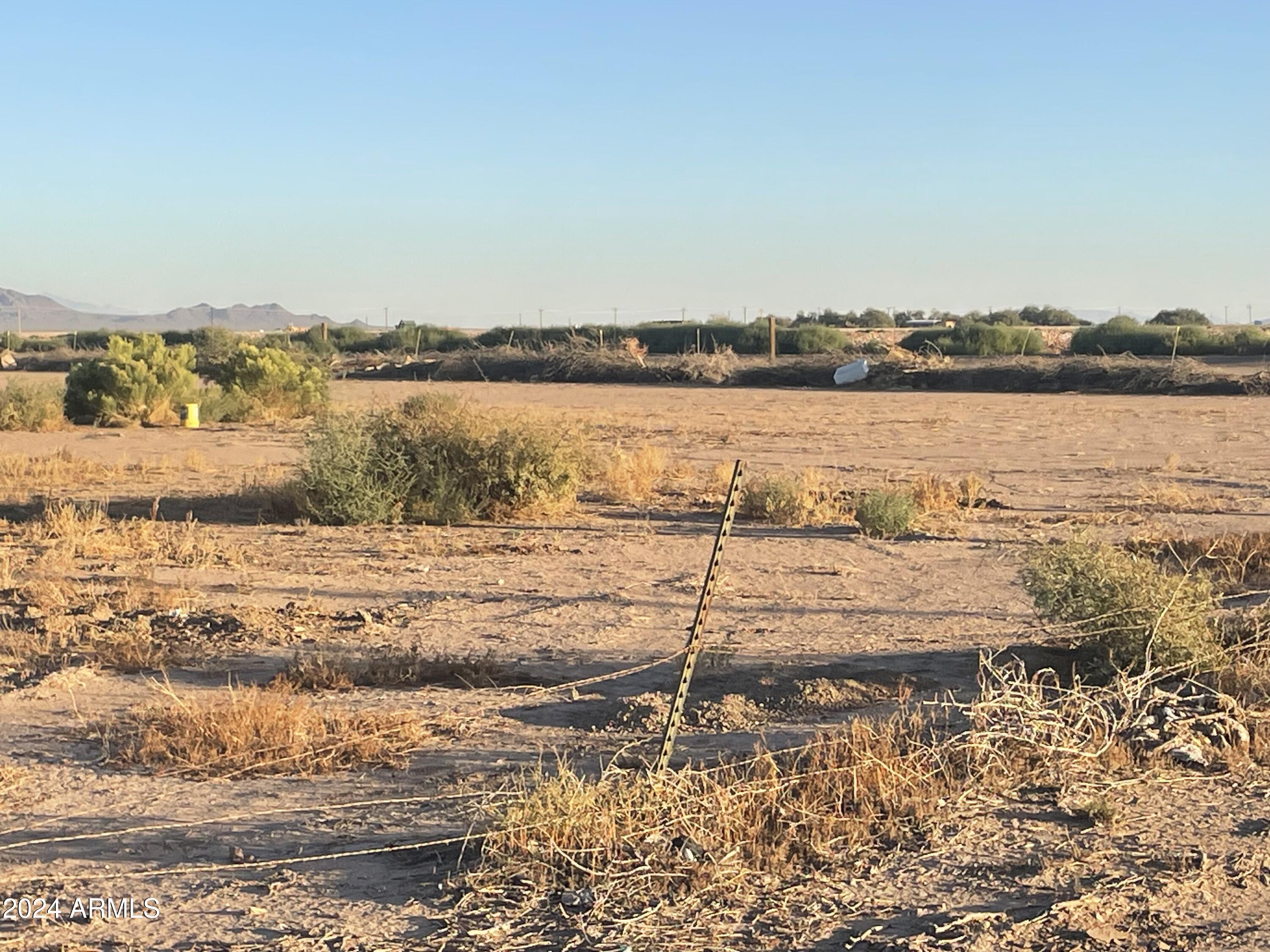 829 East Salazar Road Eloy, AZ 85131 - Photo 2 of 4 a view of a lake with a beach