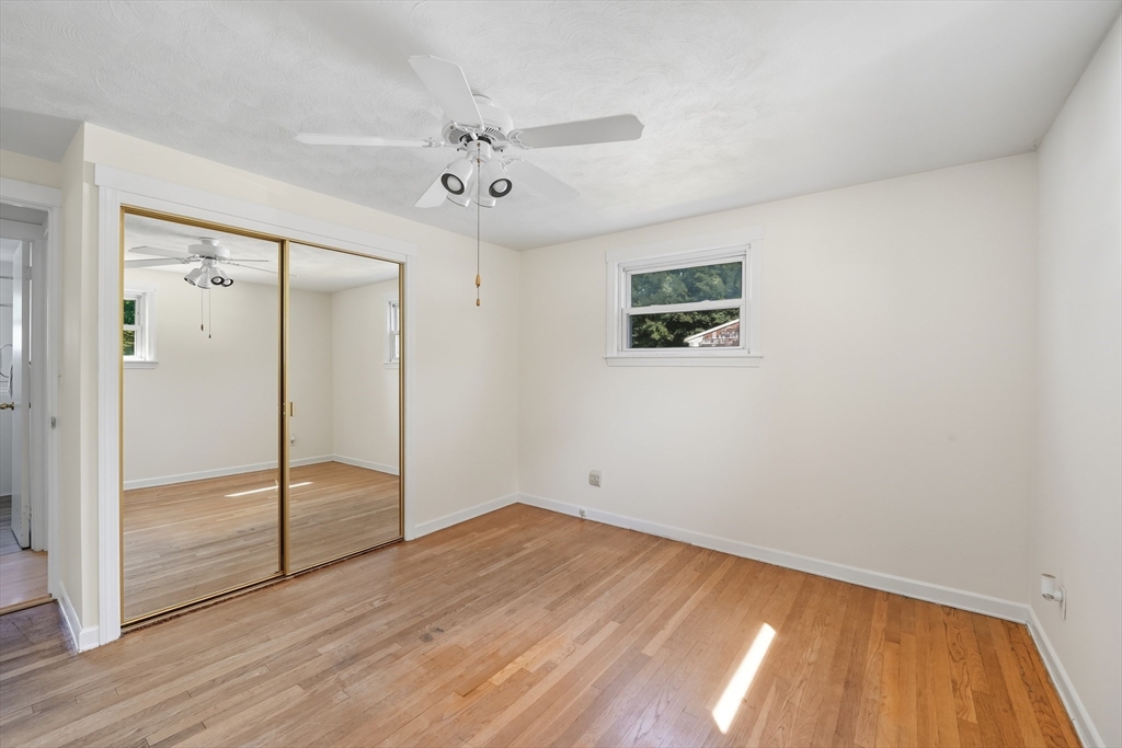 86 Talmadge Drive Springfield, MA 01118 - Photo 13 of 33 a view of empty room with wooden floor and fan