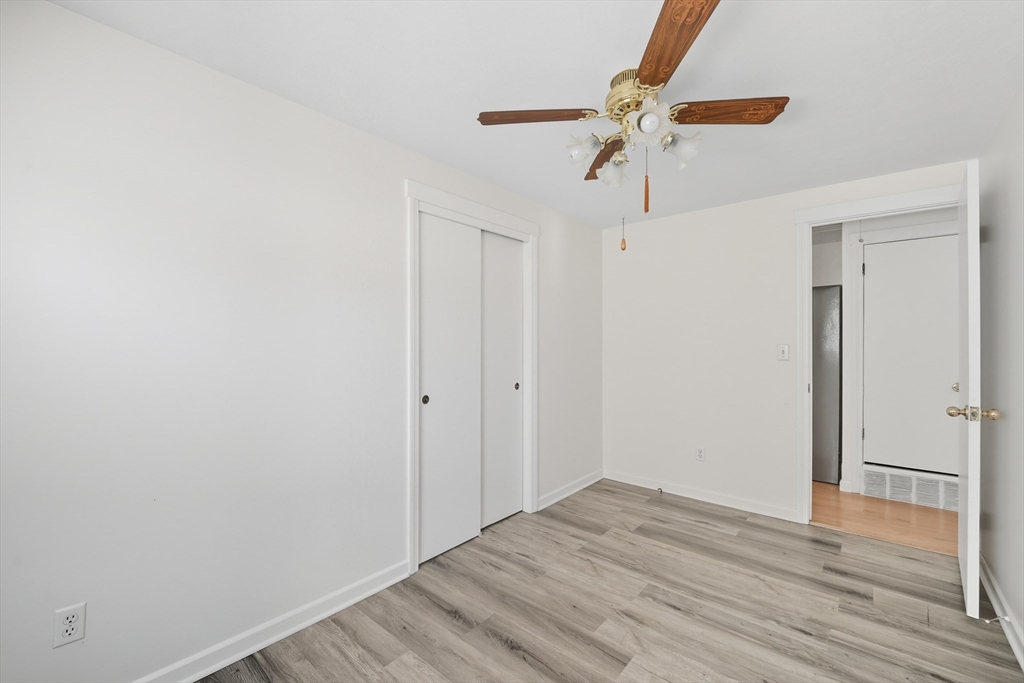 86 Talmadge Drive Springfield, MA 01118 - Photo 17 of 33 a view of empty room with wooden floor and ceiling fan