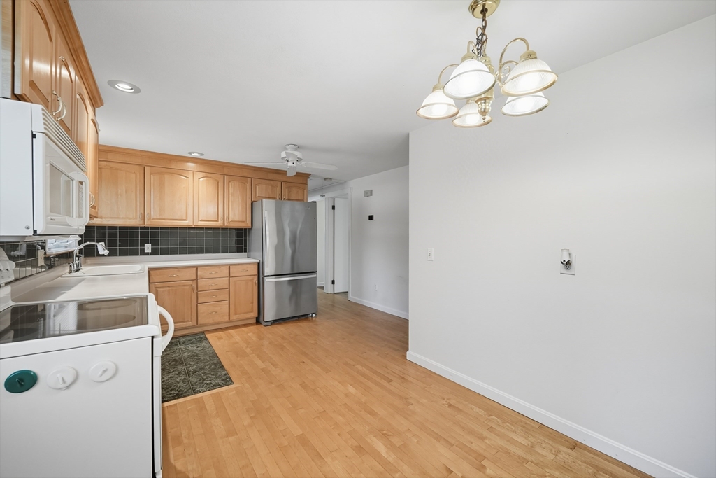 86 Talmadge Drive Springfield, MA 01118 - Photo 21 of 33 a kitchen with stainless steel appliances a refrigerator sink and cabinets