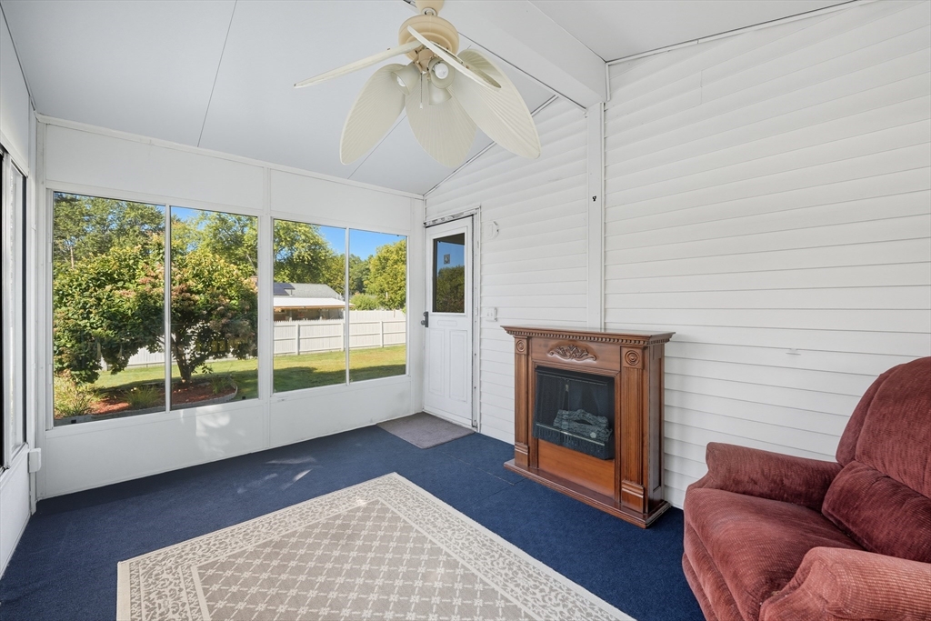 86 Talmadge Drive Springfield, MA 01118 - Photo 25 of 33 a living room with furniture and a fireplace