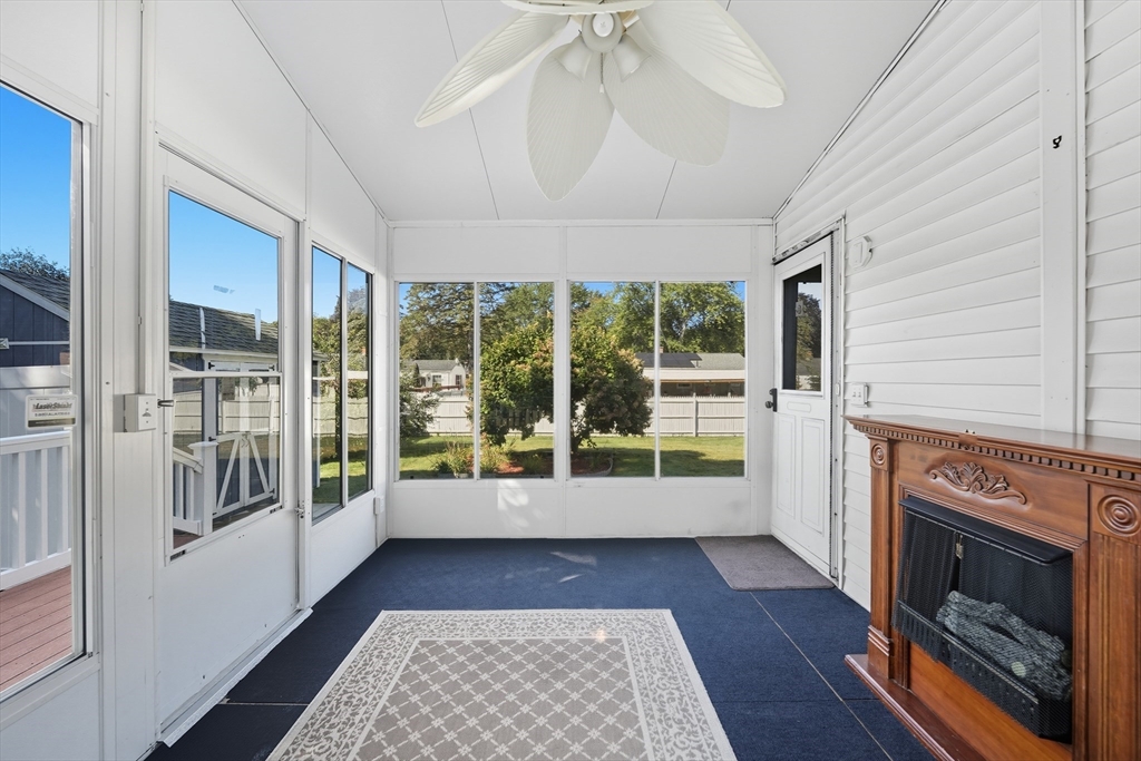 86 Talmadge Drive Springfield, MA 01118 - Photo 26 of 33 a view of empty room with wooden floor and fireplace