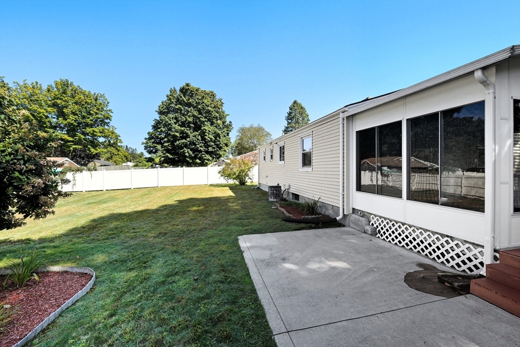 86 Talmadge Drive Springfield, MA 01118 - Photo 29 of 33 a view of a house with backyard and sitting area