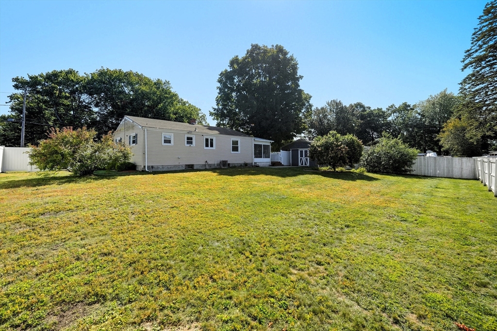 86 Talmadge Drive Springfield, MA 01118 - Photo 32 of 33 a view of a swimming pool with an outdoor space and seating area