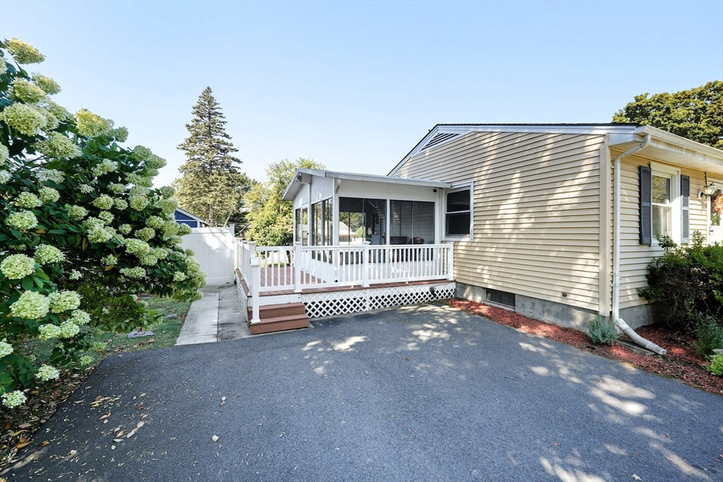 86 Talmadge Drive Springfield, MA 01118 - Photo 4 of 33 a backyard of a house with table and chairs