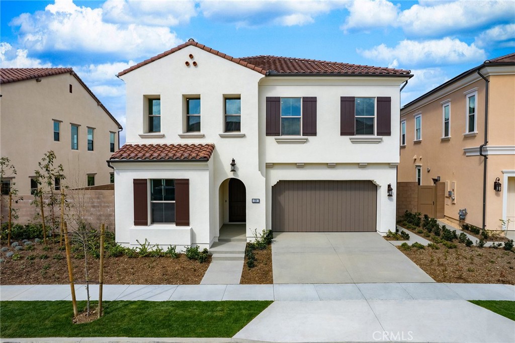 59 Longchamp Irvine, CA 92602 - Photo 1 of 3 a front view of a house with yard