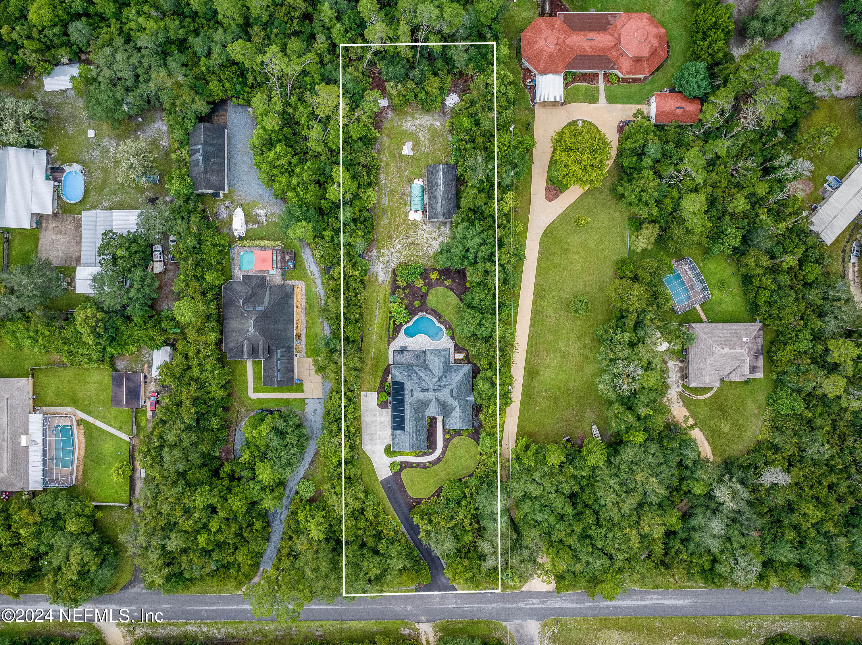 847 Oak Ridge Road St. Augustine, FL 32086 - Photo 1 of 36 an aerial view of a house with garden space and street view