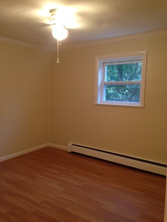 76 Bryon Road, Unit 3 Boston, MA 02467 - Photo 5 of 7 a view of a small space with wooden floor and a window