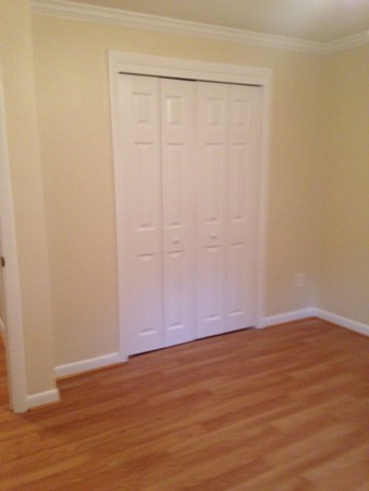 76 Bryon Road, Unit 3 Boston, MA 02467 - Photo 6 of 7 a view of an empty room with wooden floor