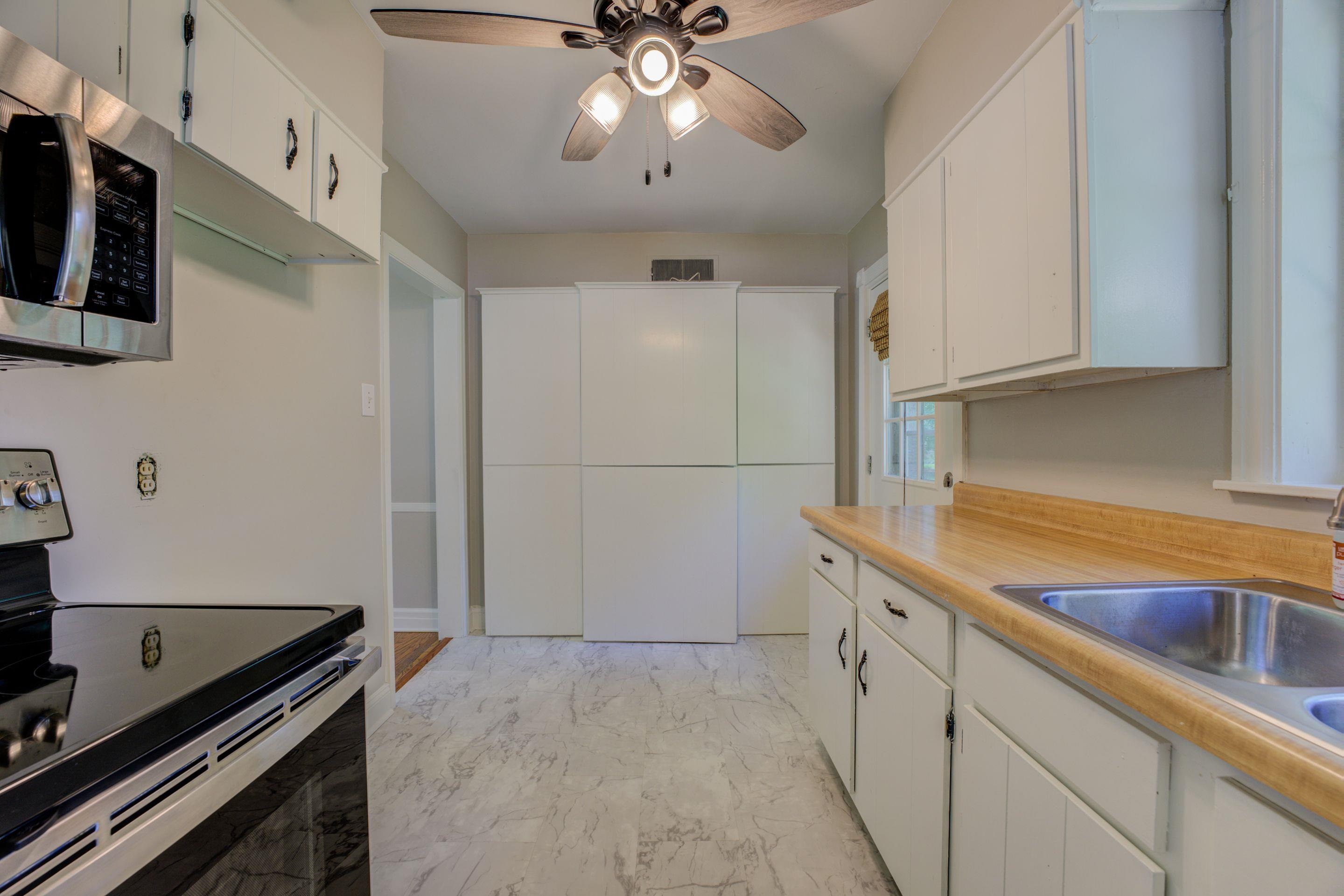 4708 Chip Road Memphis, TN 38117 - Photo 16 of 21 a kitchen with a sink appliances and cabinets