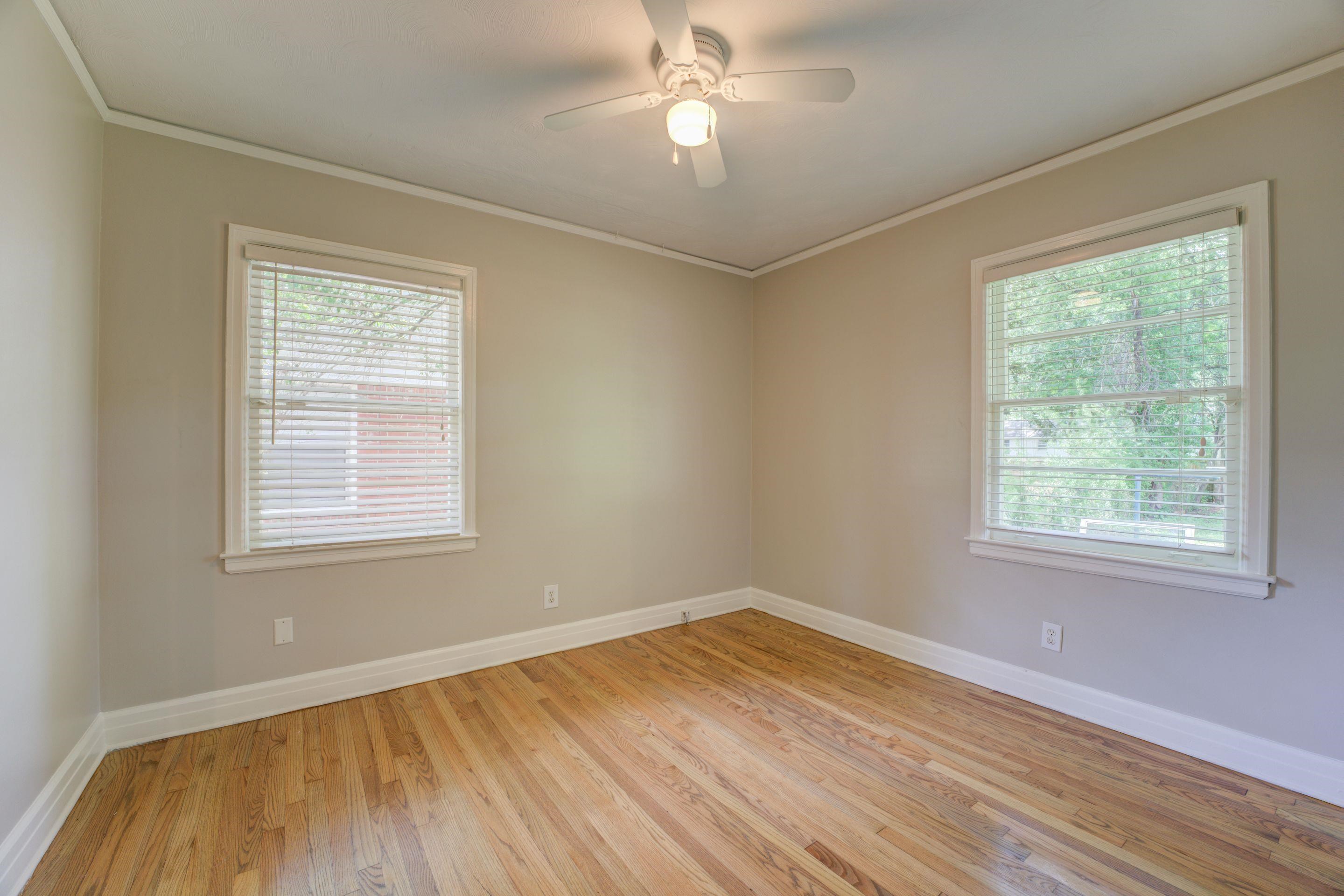 4708 Chip Road Memphis, TN 38117 - Photo 18 of 21 a view of an empty room with wooden floor and a window