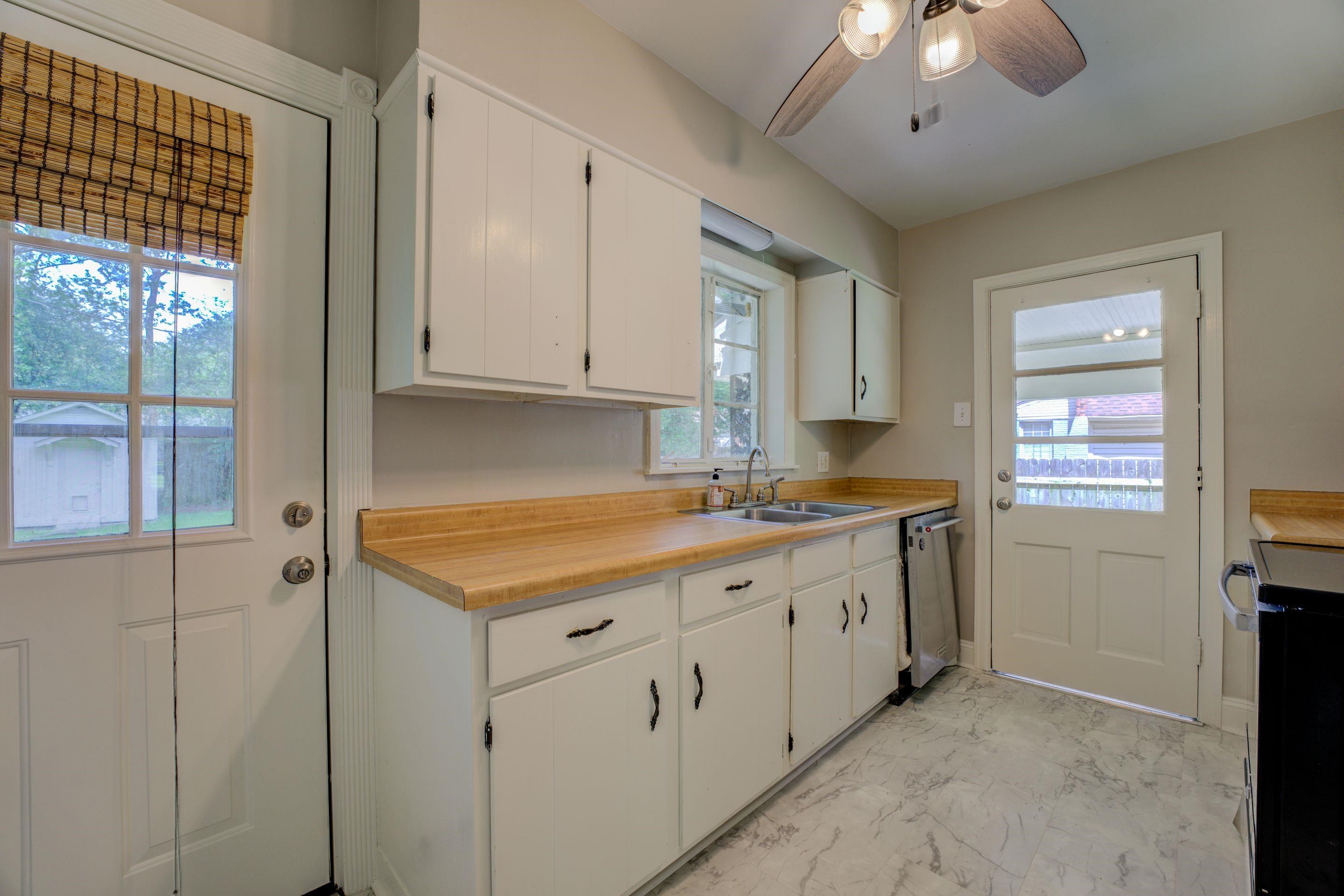 4708 Chip Road Memphis, TN 38117 - Photo 20 of 21 a kitchen with a sink stove and cabinets