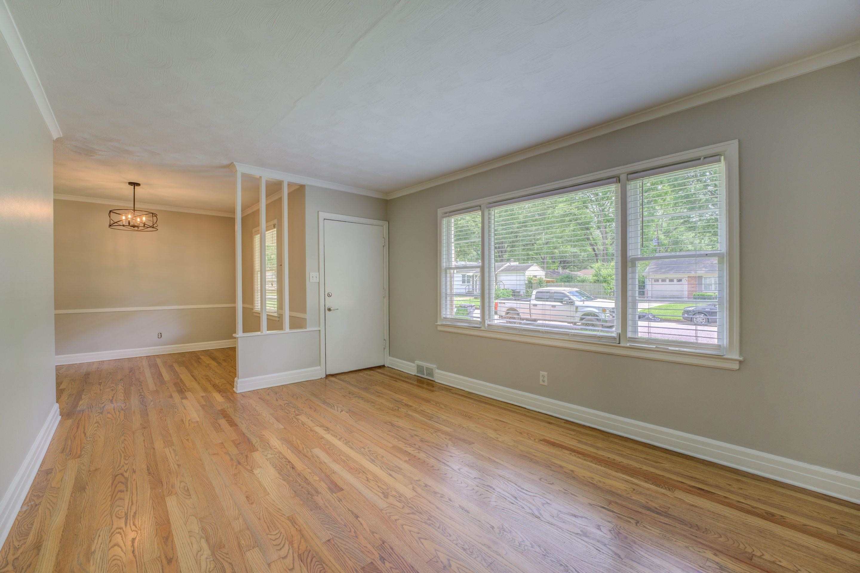 4708 Chip Road Memphis, TN 38117 - Photo 5 of 21 a view of an empty room with wooden floor and a window