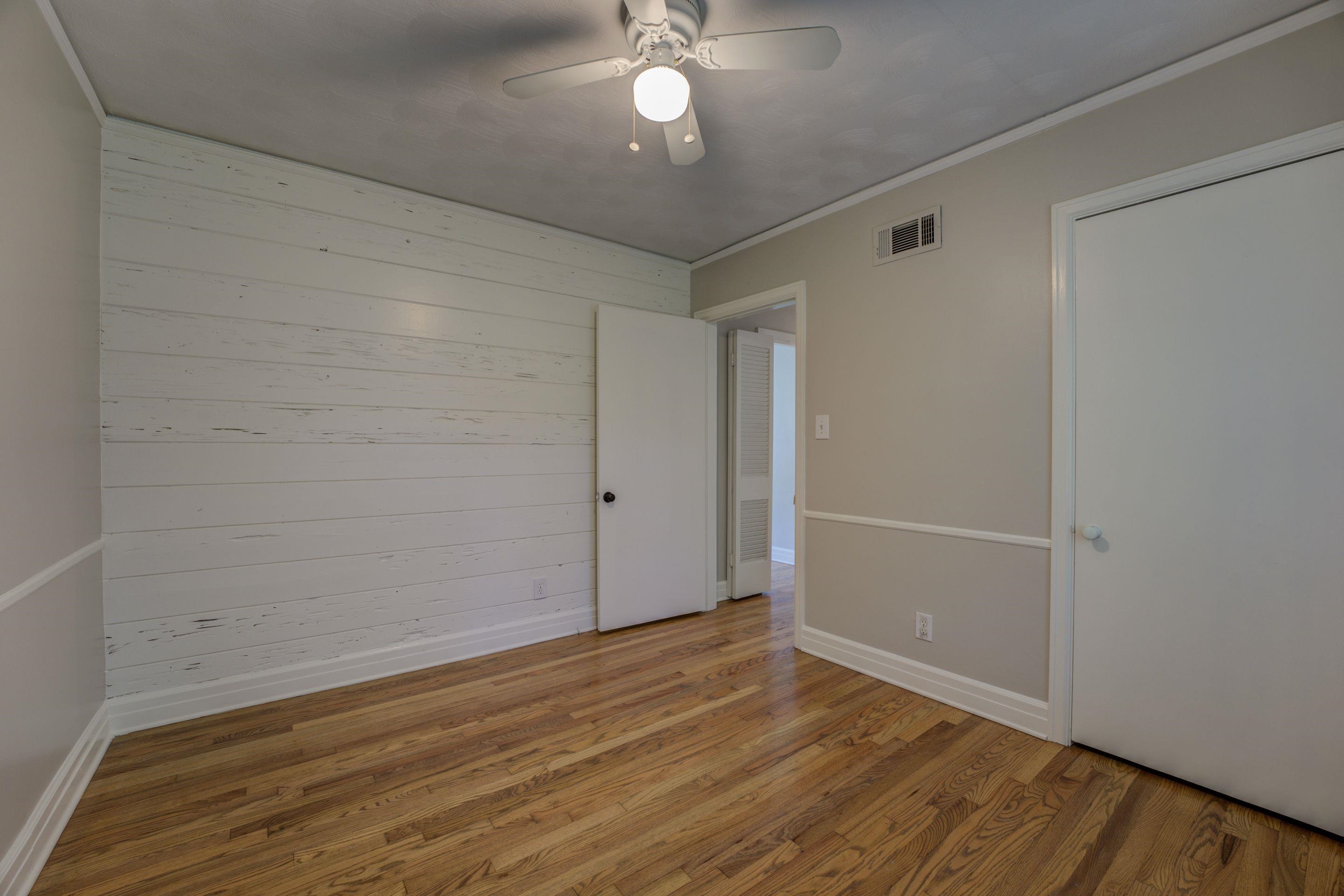 4708 Chip Road Memphis, TN 38117 - Photo 8 of 21 a view of a room with wooden floor and a ceiling fan