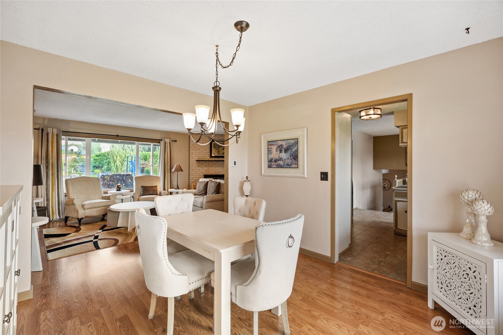 2716 8th Street Northeast East Wenatchee, WA 98802 - Photo 11 of 40 a view of a dining room and livingroom with furniture wooden floor a chandelier