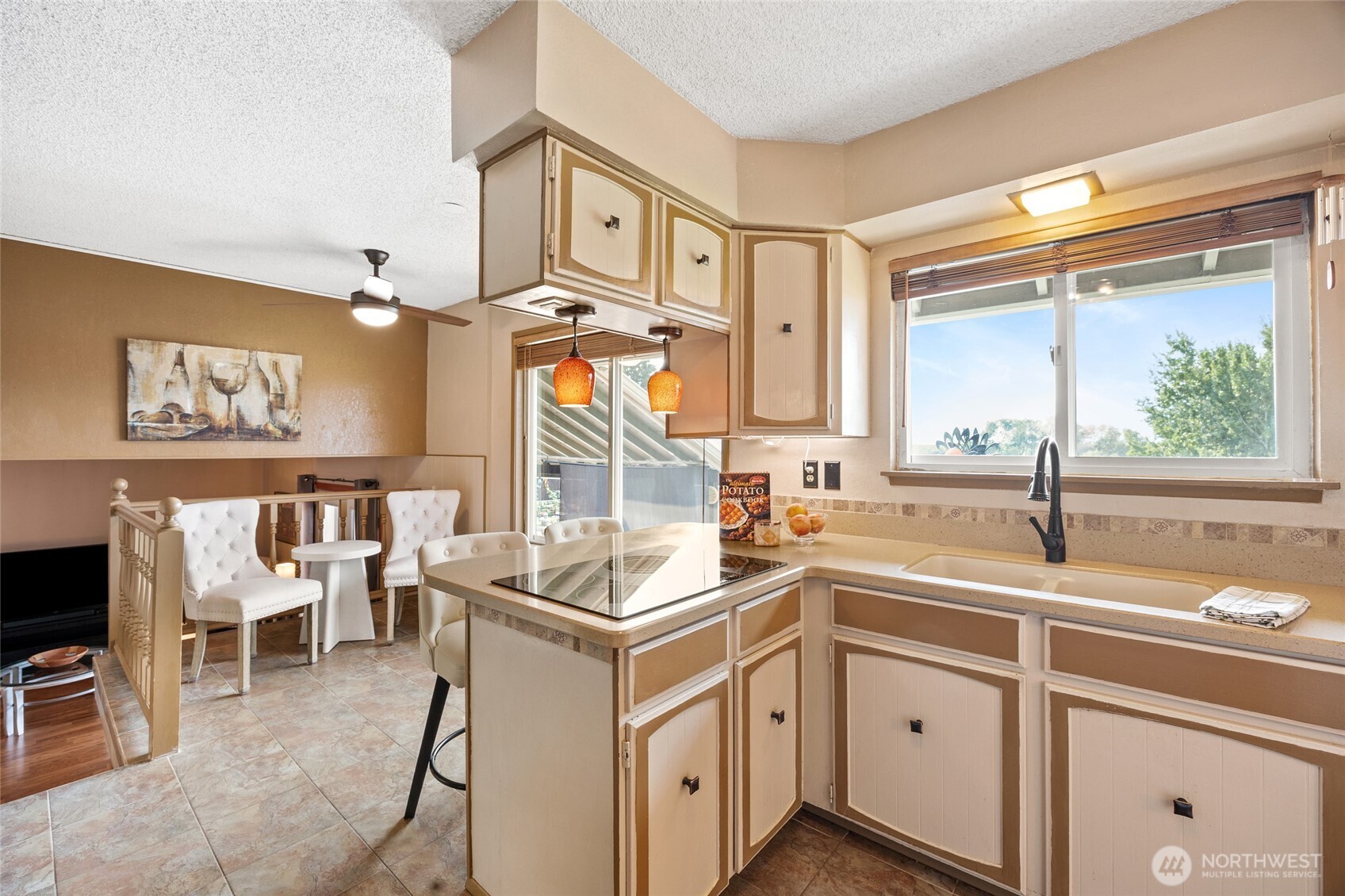 2716 8th Street Northeast East Wenatchee, WA 98802 - Photo 13 of 40 a kitchen that has a sink and a stove in it