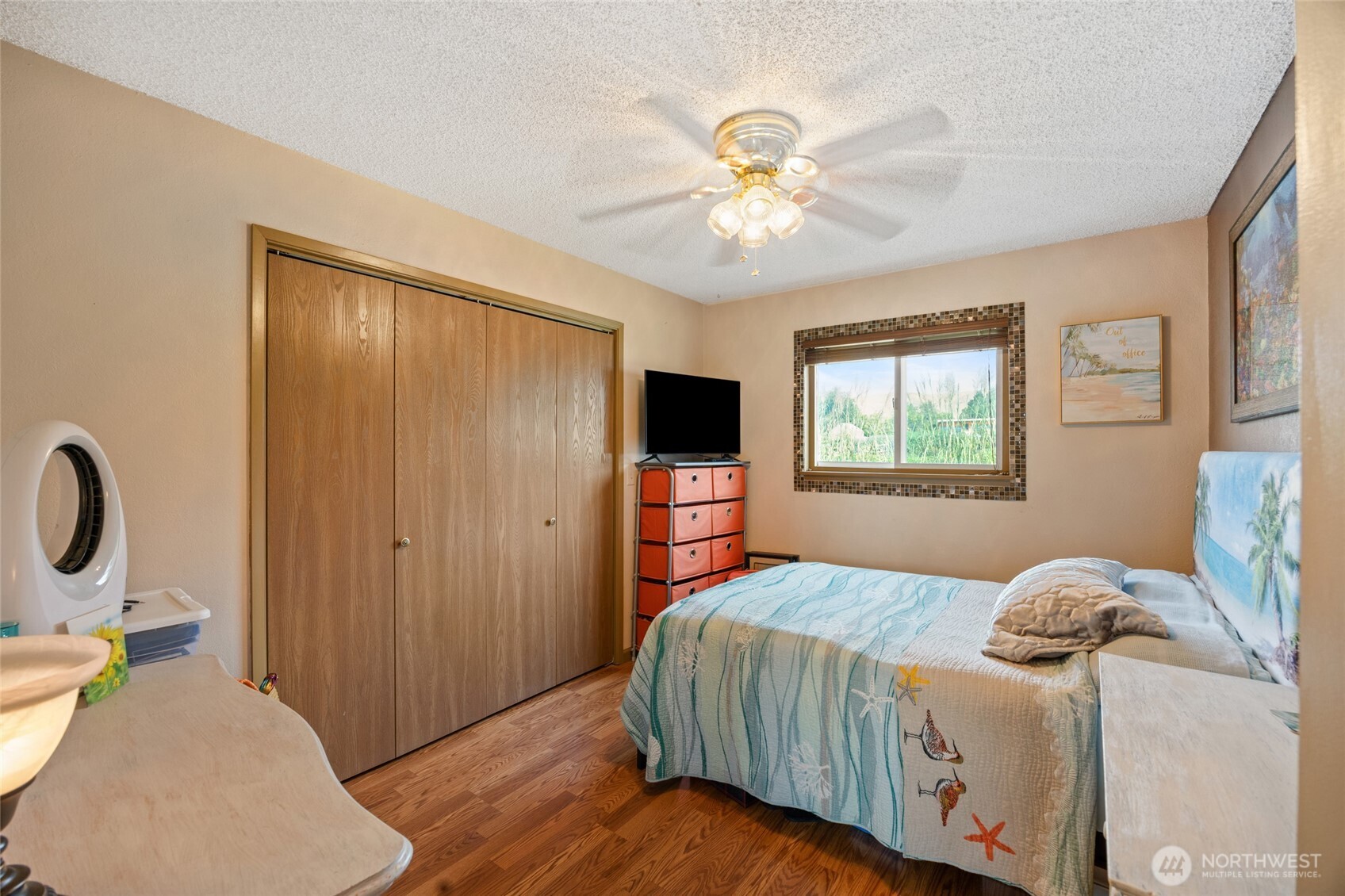 2716 8th Street Northeast East Wenatchee, WA 98802 - Photo 20 of 40 a bedroom with a bed and a chandelier
