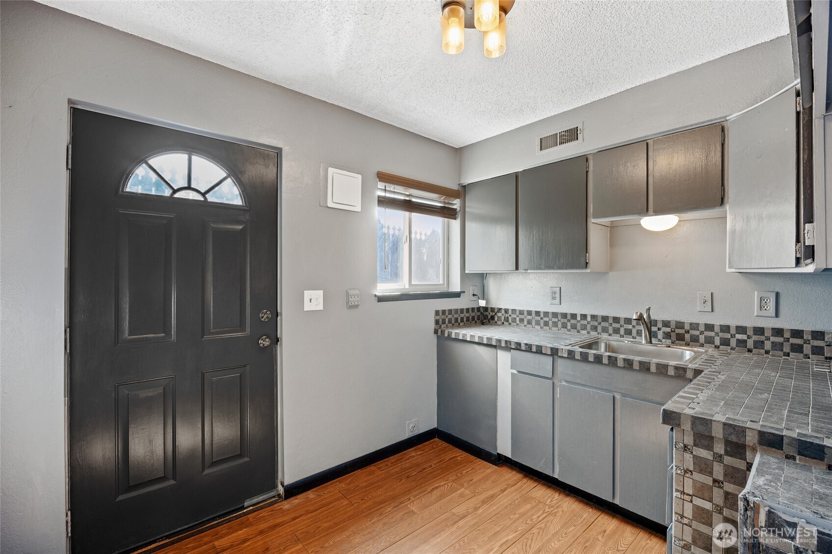 2716 8th Street Northeast East Wenatchee, WA 98802 - Photo 24 of 40 a kitchen with granite countertop stainless steel appliances a sink stove and refrigerator