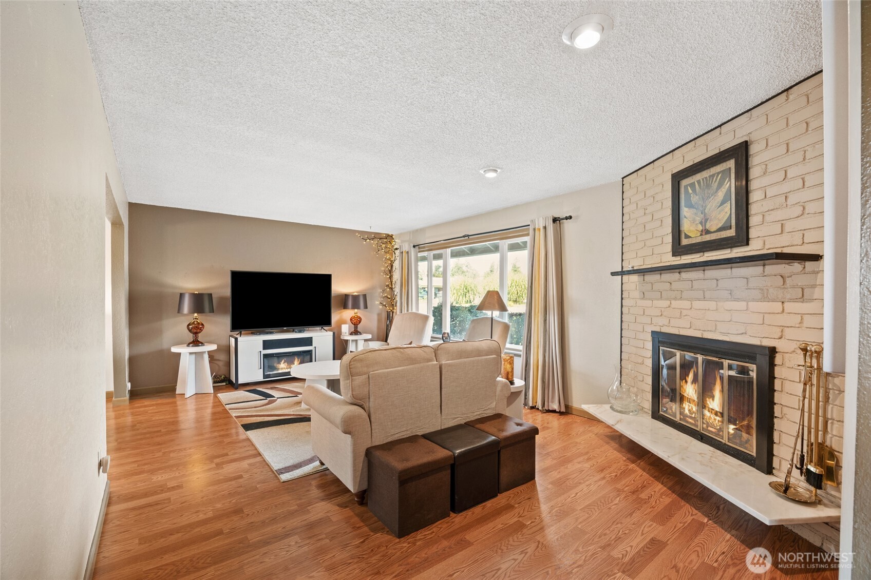 2716 8th Street Northeast East Wenatchee, WA 98802 - Photo 7 of 40 a living room with furniture and a flat screen tv