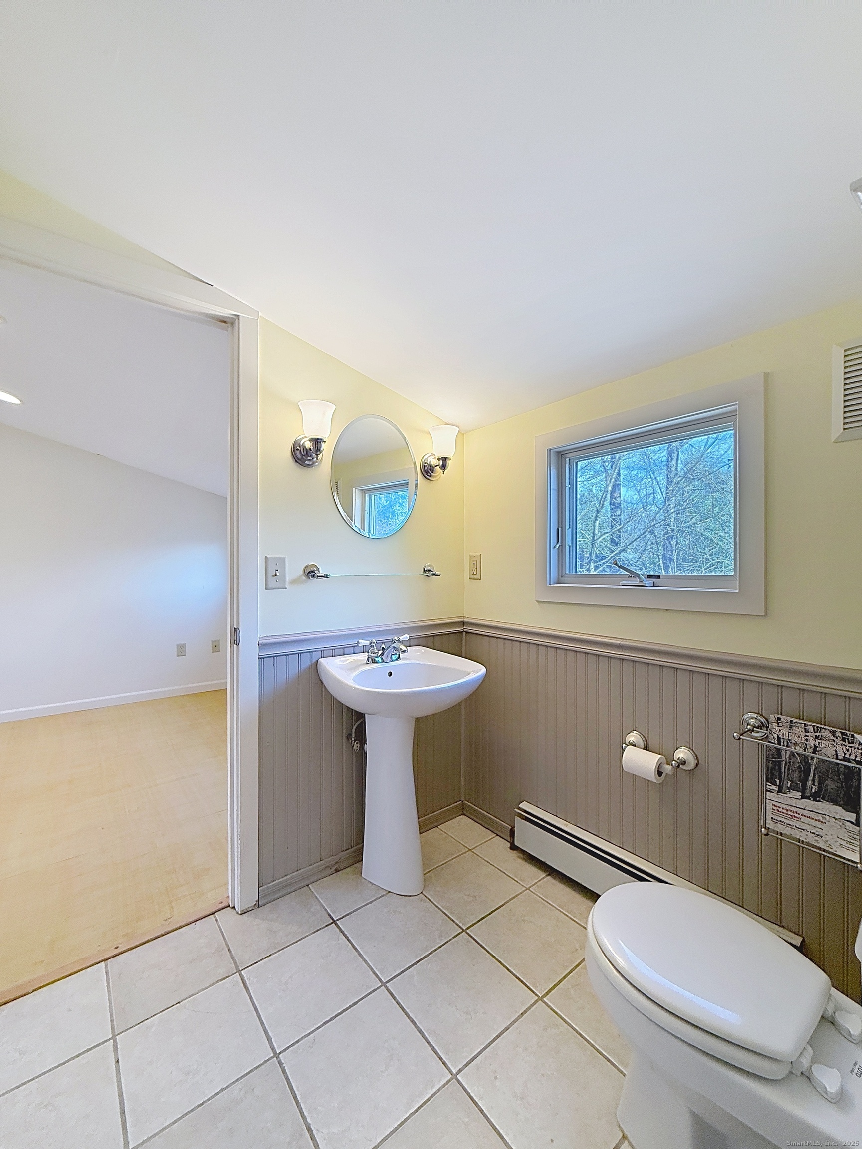 198 Forest Road Coventry, CT 06238 - Photo 16 of 24 a bathroom with a sink a toilet and mirror