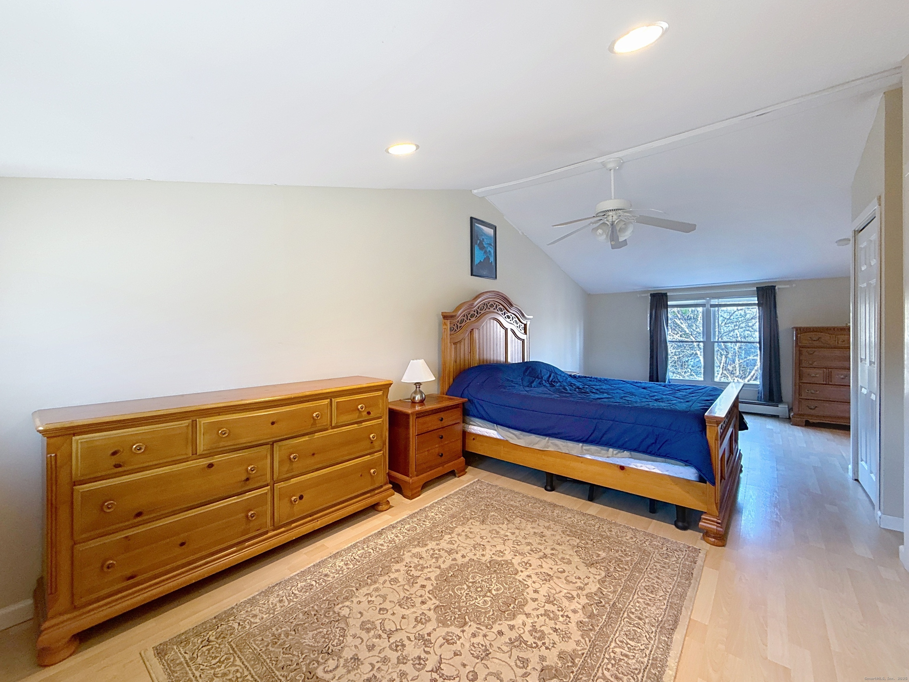 198 Forest Road Coventry, CT 06238 - Photo 18 of 24 a bedroom with a bed and wooden floor