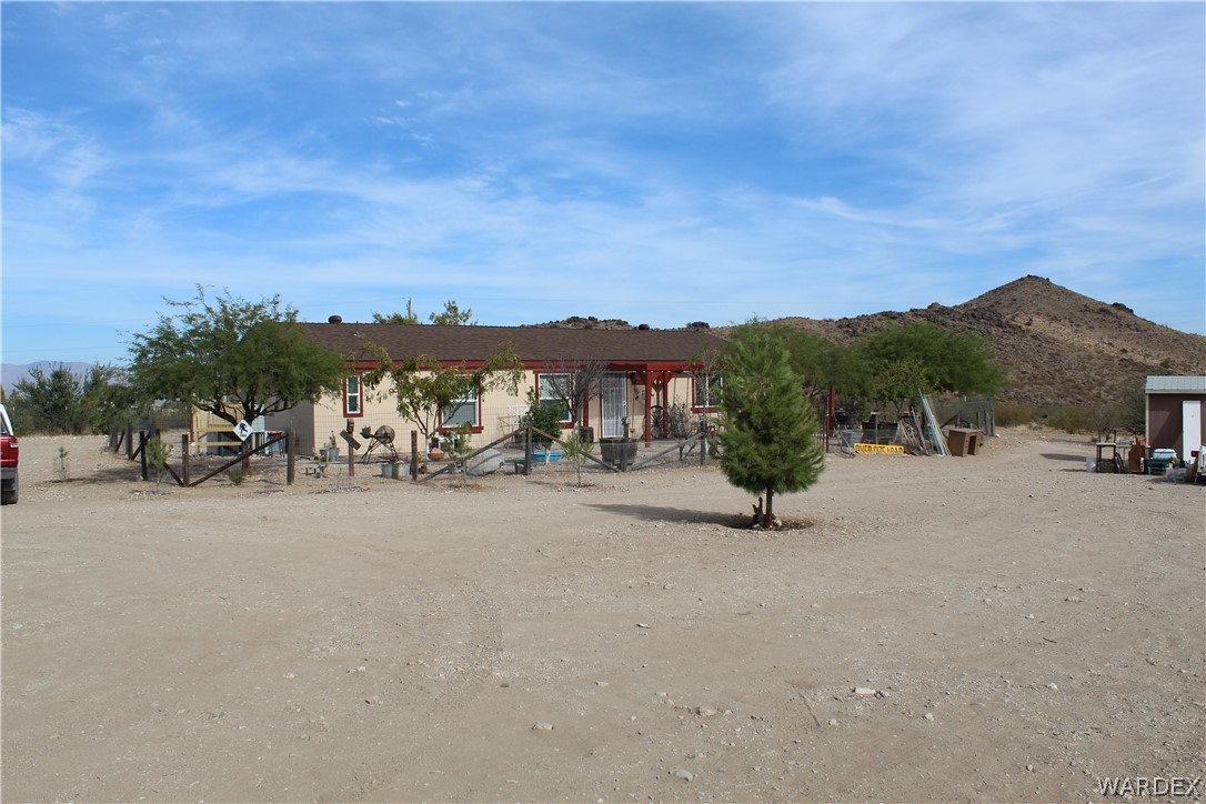 1950 Growler Road Golden Valley, AZ 86413 - Photo 1 of 42 a view of a road with a terrace