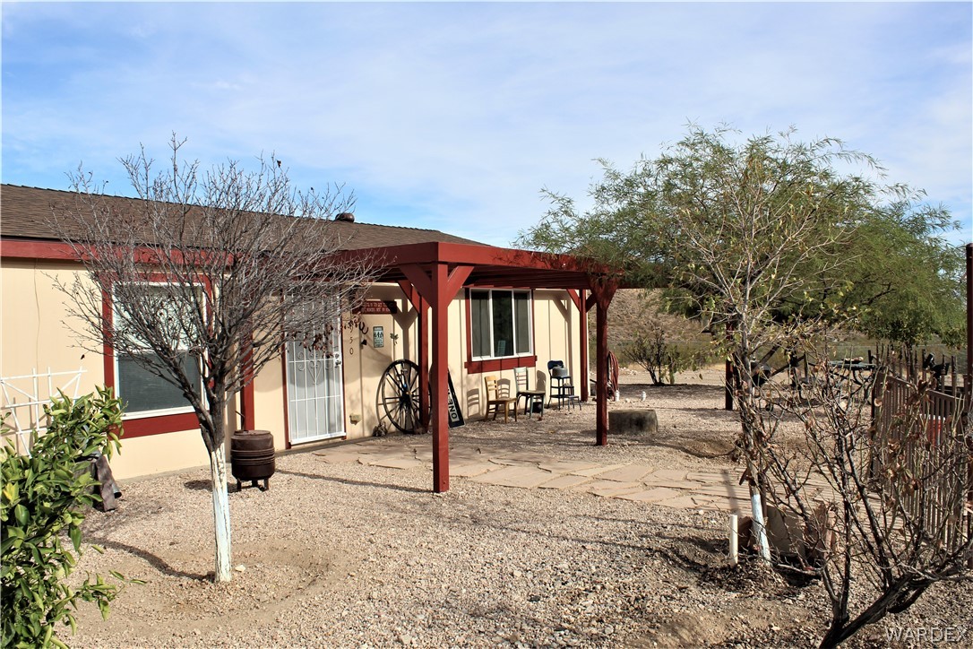 1950 Growler Road Golden Valley, AZ 86413 - Photo 12 of 42 a front view of a house with garden