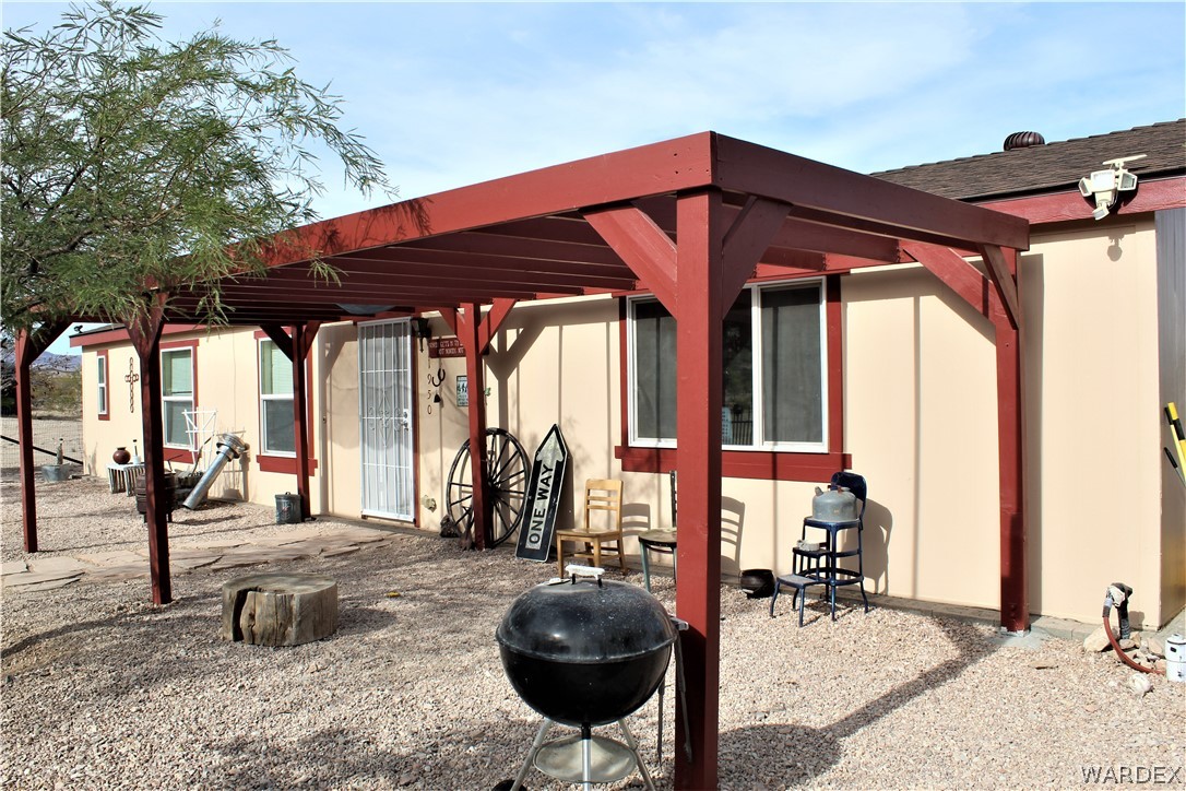 1950 Growler Road Golden Valley, AZ 86413 - Photo 14 of 42 a view of a chairs and table in patio