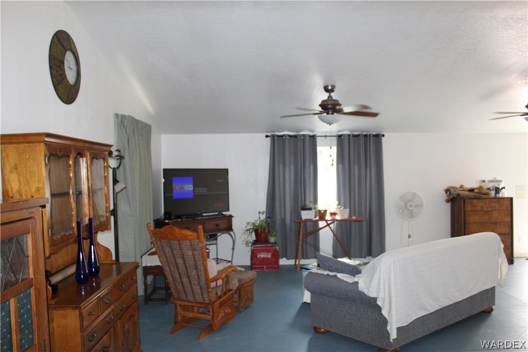 1950 Growler Road Golden Valley, AZ 86413 - Photo 27 of 42 a living room with furniture and a flat screen tv