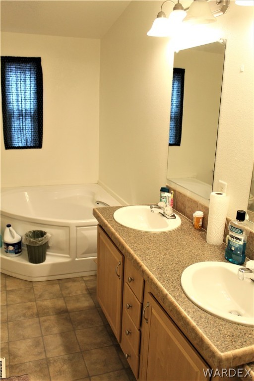 1950 Growler Road Golden Valley, AZ 86413 - Photo 38 of 42 a bathroom with a sink and a mirror