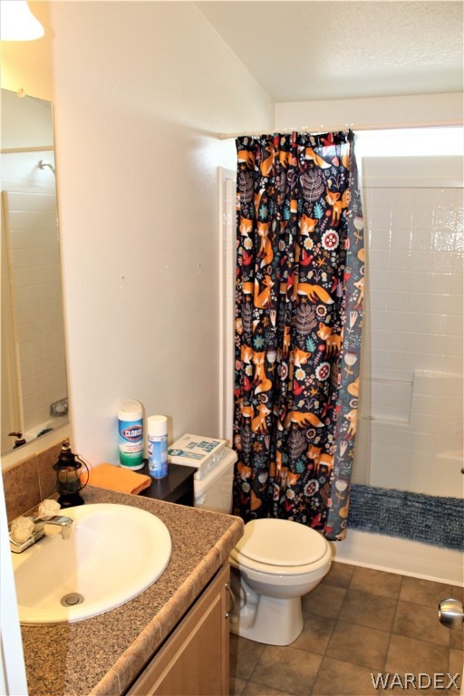 1950 Growler Road Golden Valley, AZ 86413 - Photo 40 of 42 a bathroom with a sink toilet and shower