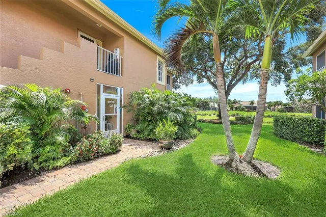 a front view of a house with a garden and entryway