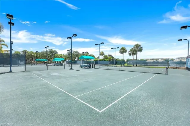 a swimming pool with outdoor seating and yard