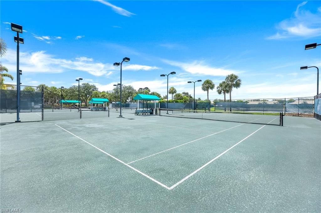 13201 Sherburne Circle, Unit 102 Bonita Springs, FL 34135 - Photo 21 of 22 a view of a tennis court