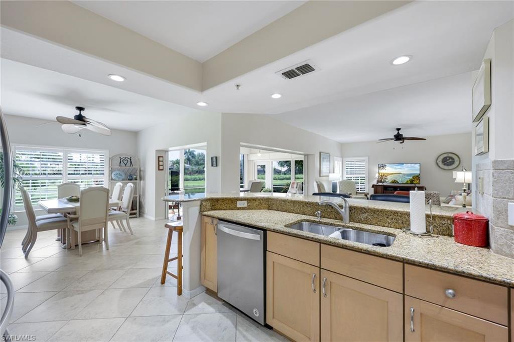 13201 Sherburne Circle, Unit 102 Bonita Springs, FL 34135 - Photo 22 of 22 a kitchen with sink and cabinets