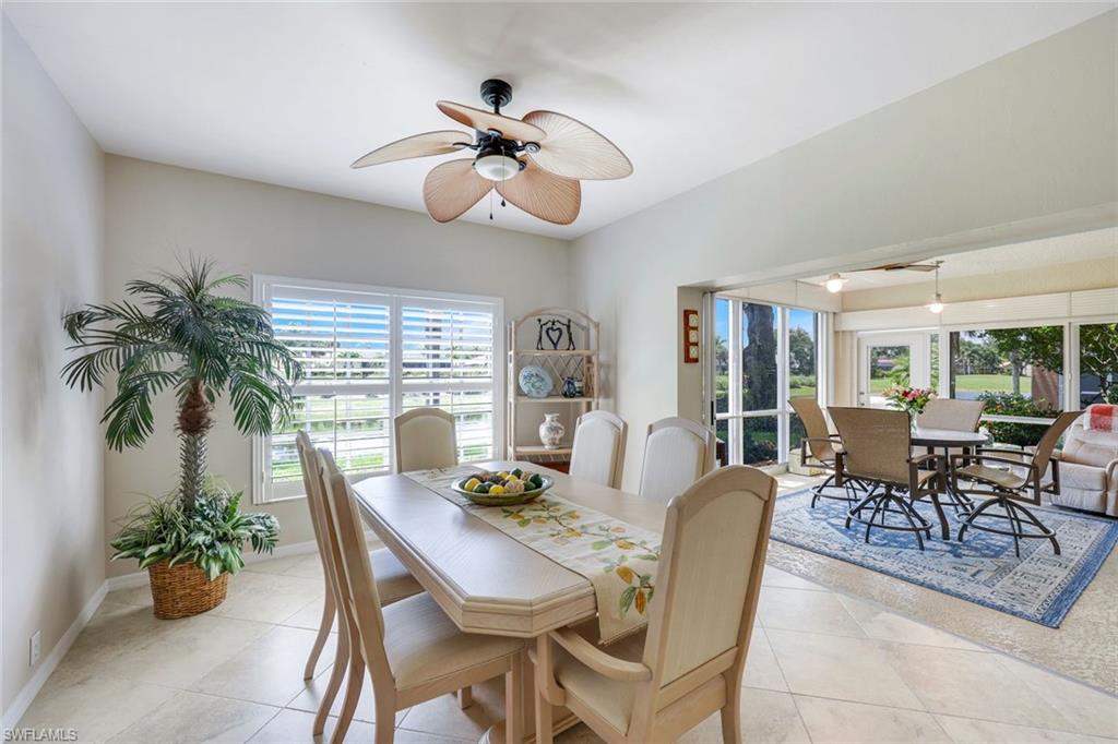 13201 Sherburne Circle, Unit 102 Bonita Springs, FL 34135 - Photo 6 of 22 a view of a dining room with furniture window and outside view