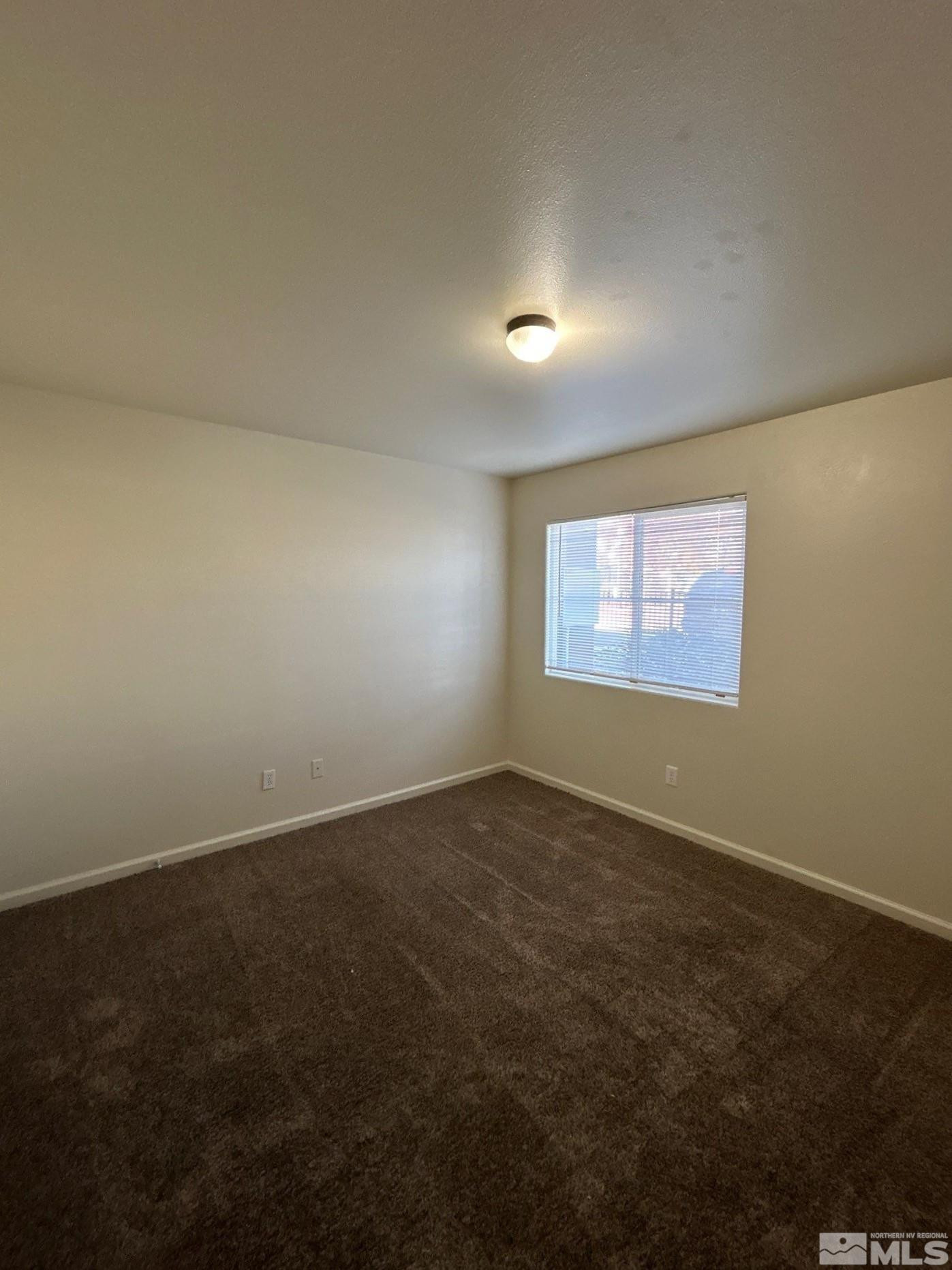 2000 Silverada Boulevard, Unit 112 Reno, NV 89512 - Photo 11 of 19 an empty room with a window