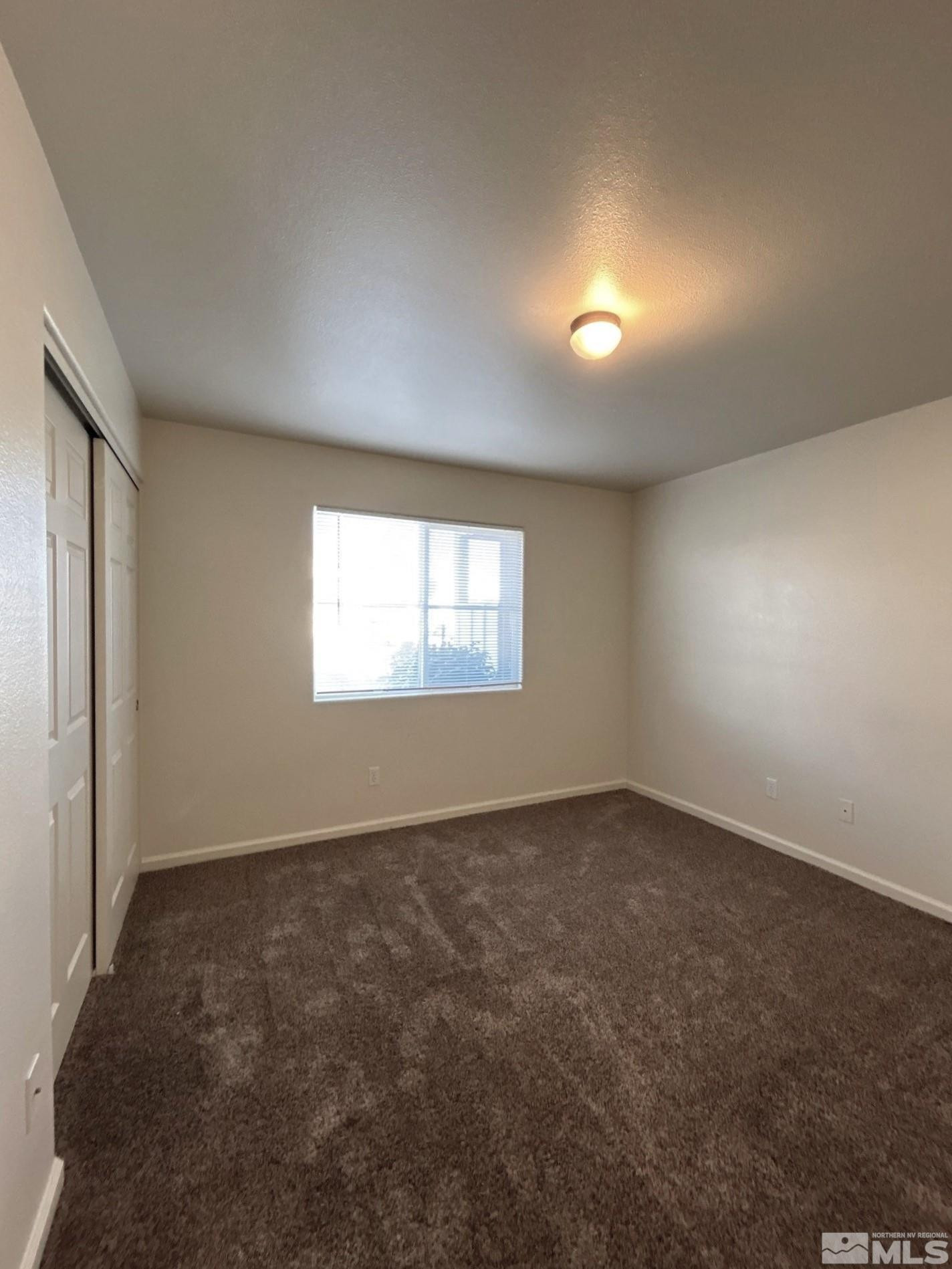 2000 Silverada Boulevard, Unit 112 Reno, NV 89512 - Photo 15 of 19 an empty room with a empty space and windows