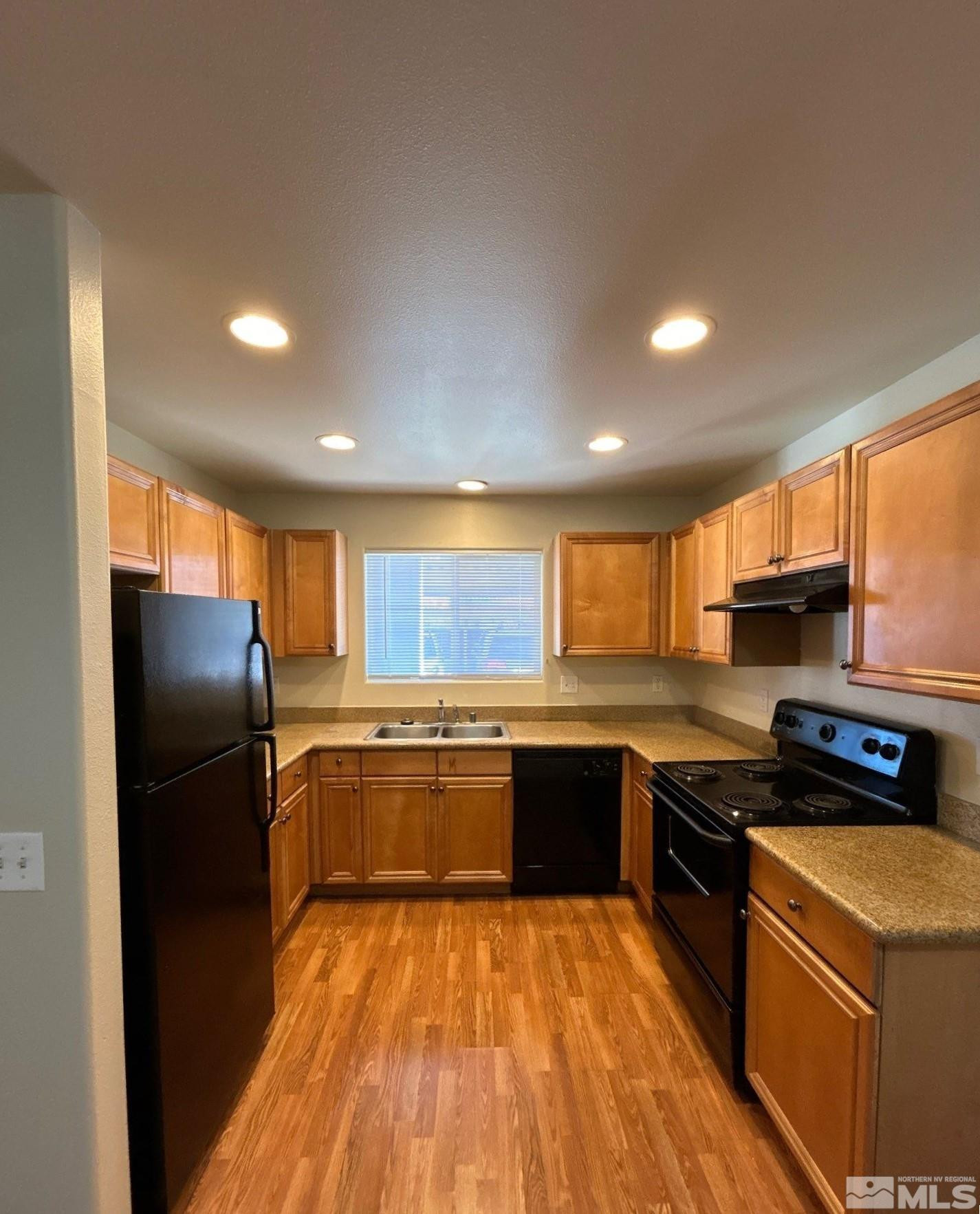 2000 Silverada Boulevard, Unit 112 Reno, NV 89512 - Photo 6 of 19 a kitchen with stainless steel appliances granite countertop a refrigerator a sink dishwasher a stove and a refrigerator