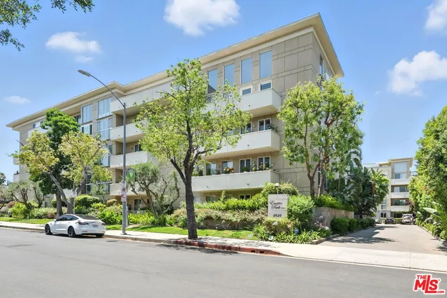 a view of a street with a building in the background