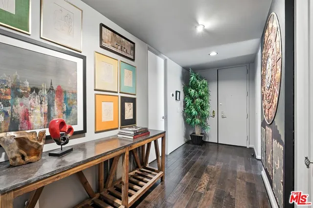 a view of an entryway with wooden floor