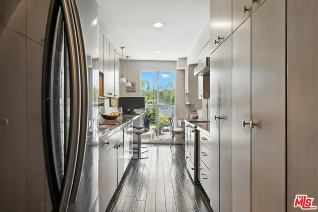 a view of a kitchen from the hallway
