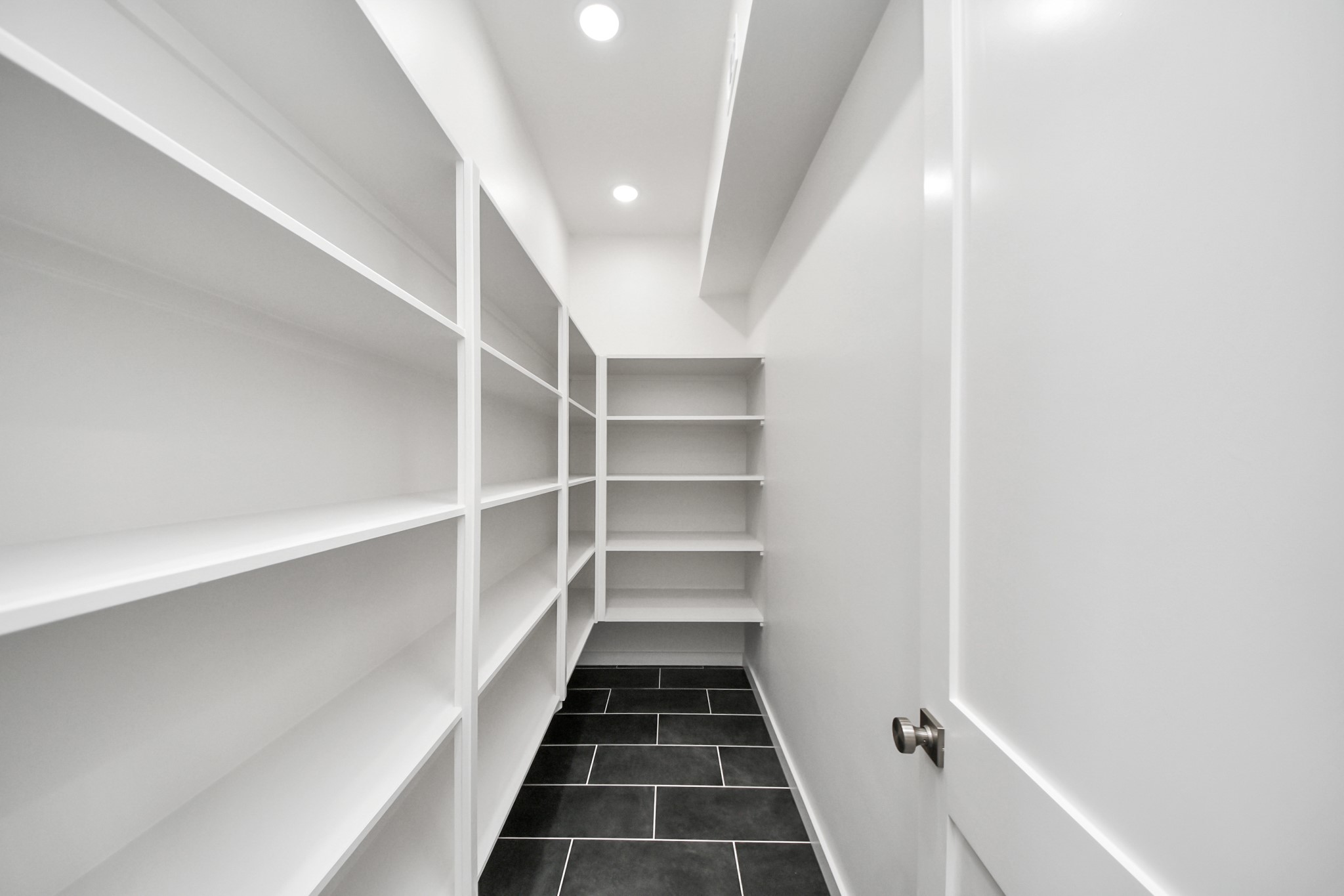 4541 Walker Street Houston, TX 77023 - Photo 11 of 24 a view of a hallway with white walls and a window