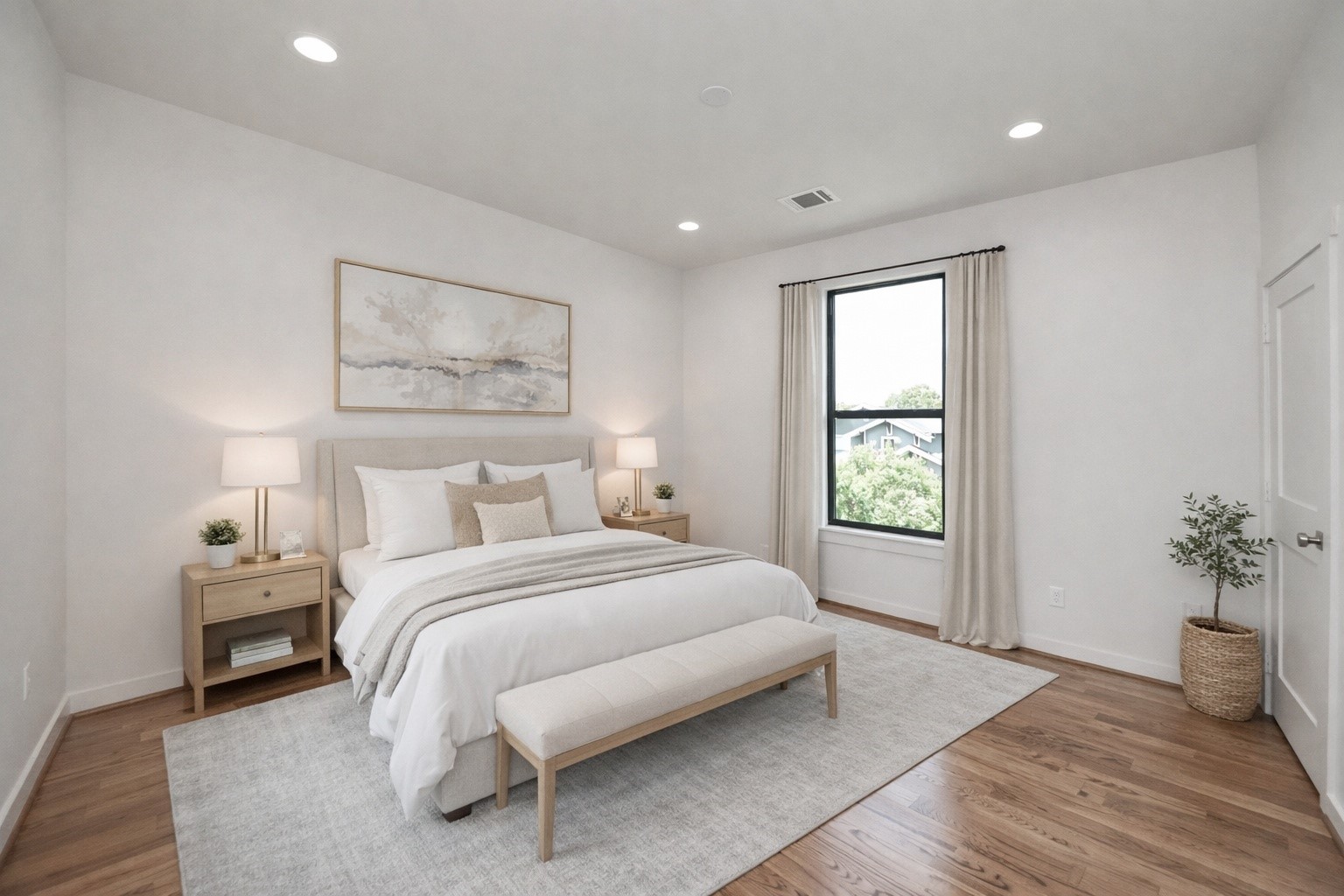 4541 Walker Street Houston, TX 77023 - Photo 16 of 24 a spacious bedroom with a bed and a potted plant