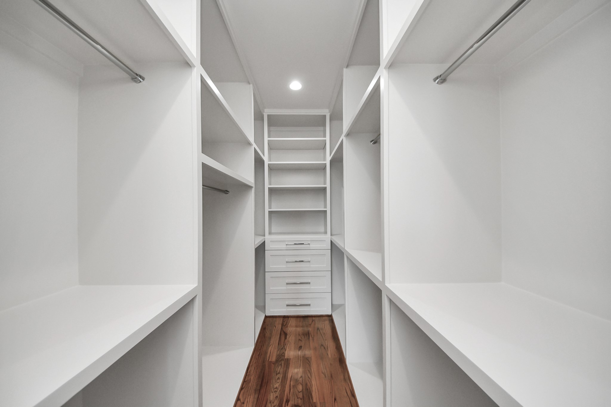 4541 Walker Street Houston, TX 77023 - Photo 18 of 24 a view of walk in closet with empty racks